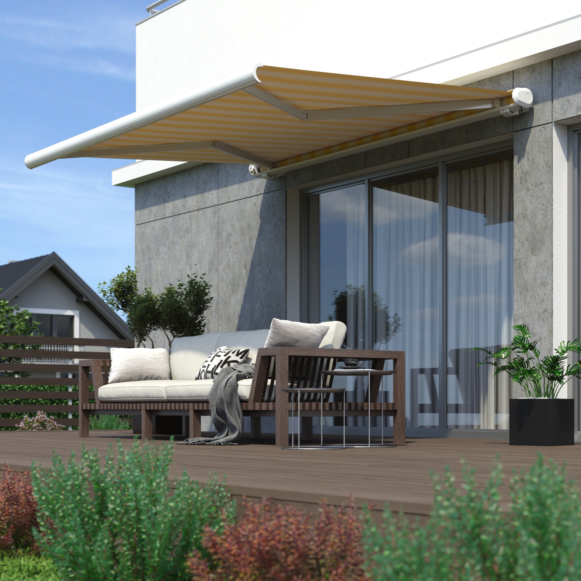 Terrasse mit Kassettenmarkise und Sitzbereich vor einem modernen Gebäude